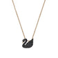 Swarovski Iconic Swan pendantBlack swan-shaped pendant on a gold chain against a white background