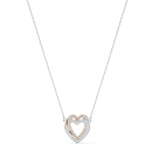 Heart-shaped necklace with rose gold and silver design on a white background