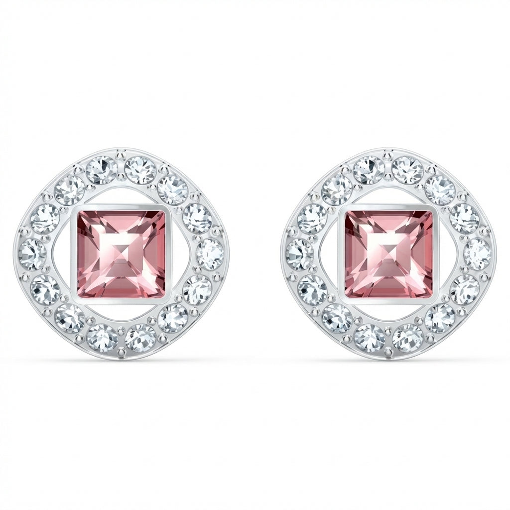 Pair of earrings with pink gemstones and silver circular designs on a white background