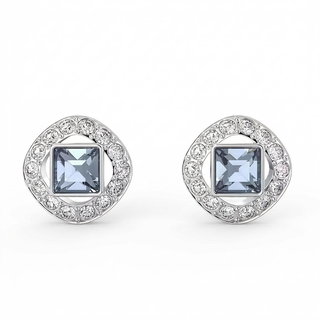 Pair of silver earrings with square gemstones on a white background