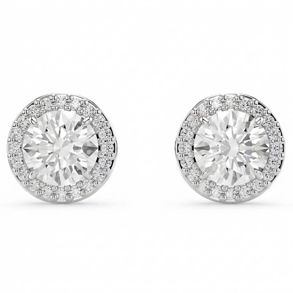 Pair of diamond stud earrings on a white background