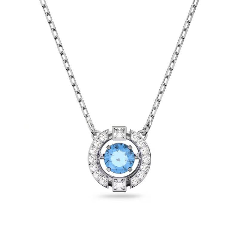 Swarovski Una Collection NecklaceSilver necklace with a blue gemstone pendant on a white background