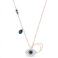 Necklace with blue gemstones and a silver evil eye pendant on a white background