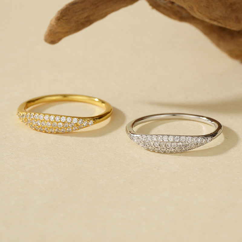 “Close-up of micro-pavé cubic zirconia detailing on sterling silver ring”