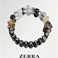 Beaded bracelet with colorful beads and letter beads spelling 'REPUTATION' on a white background, branded 'Zerra'.