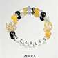 Bracelet with yellow, black, and white beads spelling 'FEARLES' on a light gray background.