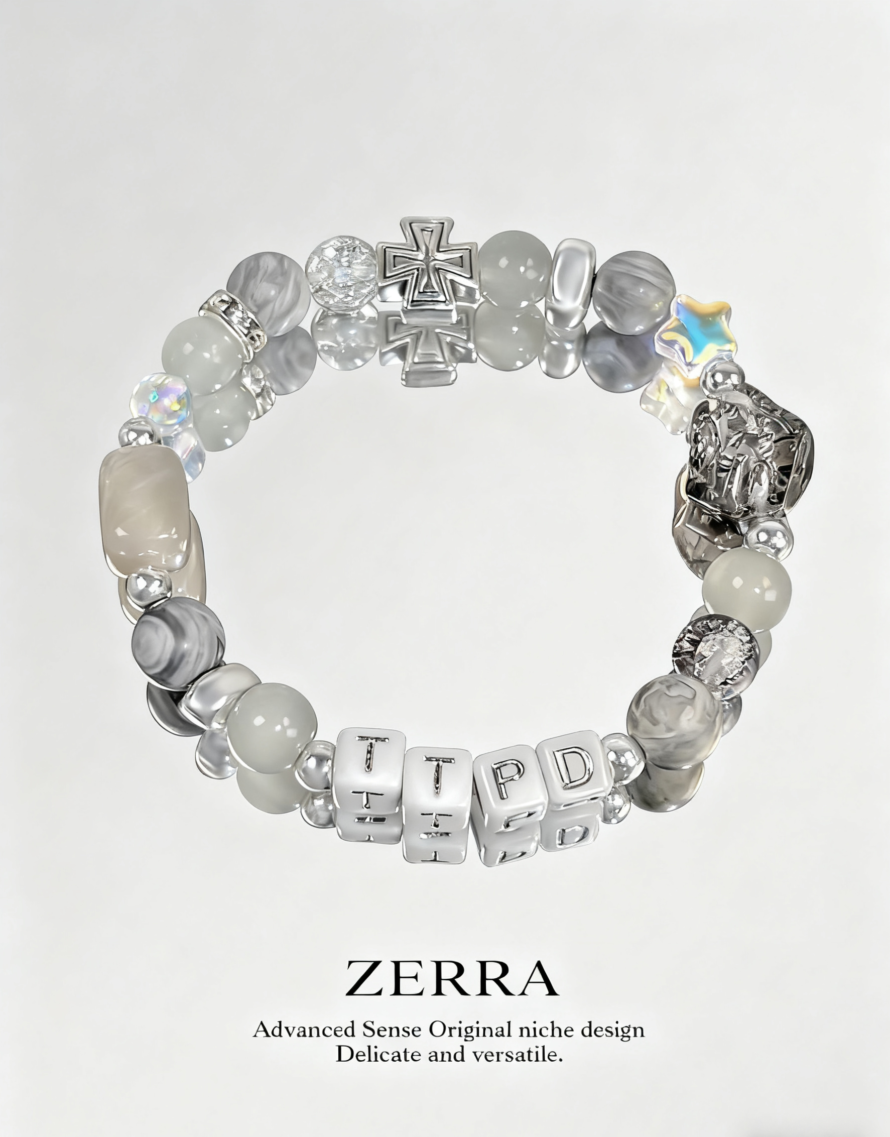 Beaded bracelet with letter beads and a cross charm on a light gray background, featuring the brand 'Zerra'.