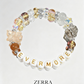 Colorful beaded bracelet with 'EVERMORE' on a light gray background, featuring the brand 'ZERRA'.