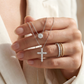 : Straight-on to clearly showcase the two different chain lengths and the continuous pave coverage on both chains.