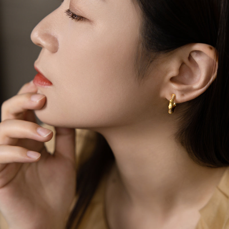 Model Wearing Bamboo-Inspired Silver Stud Earrings – Elegant Look
