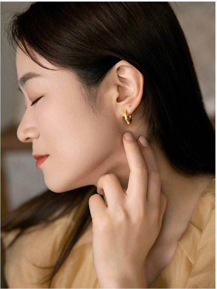 Model Wearing Bamboo-Inspired Silver Stud Earrings – Elegant Look