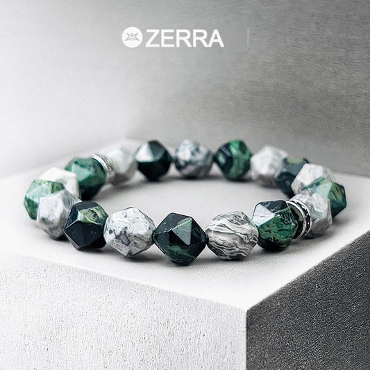 Bracelet with green and silver beads on a gray surface, featuring the Zerra brand.