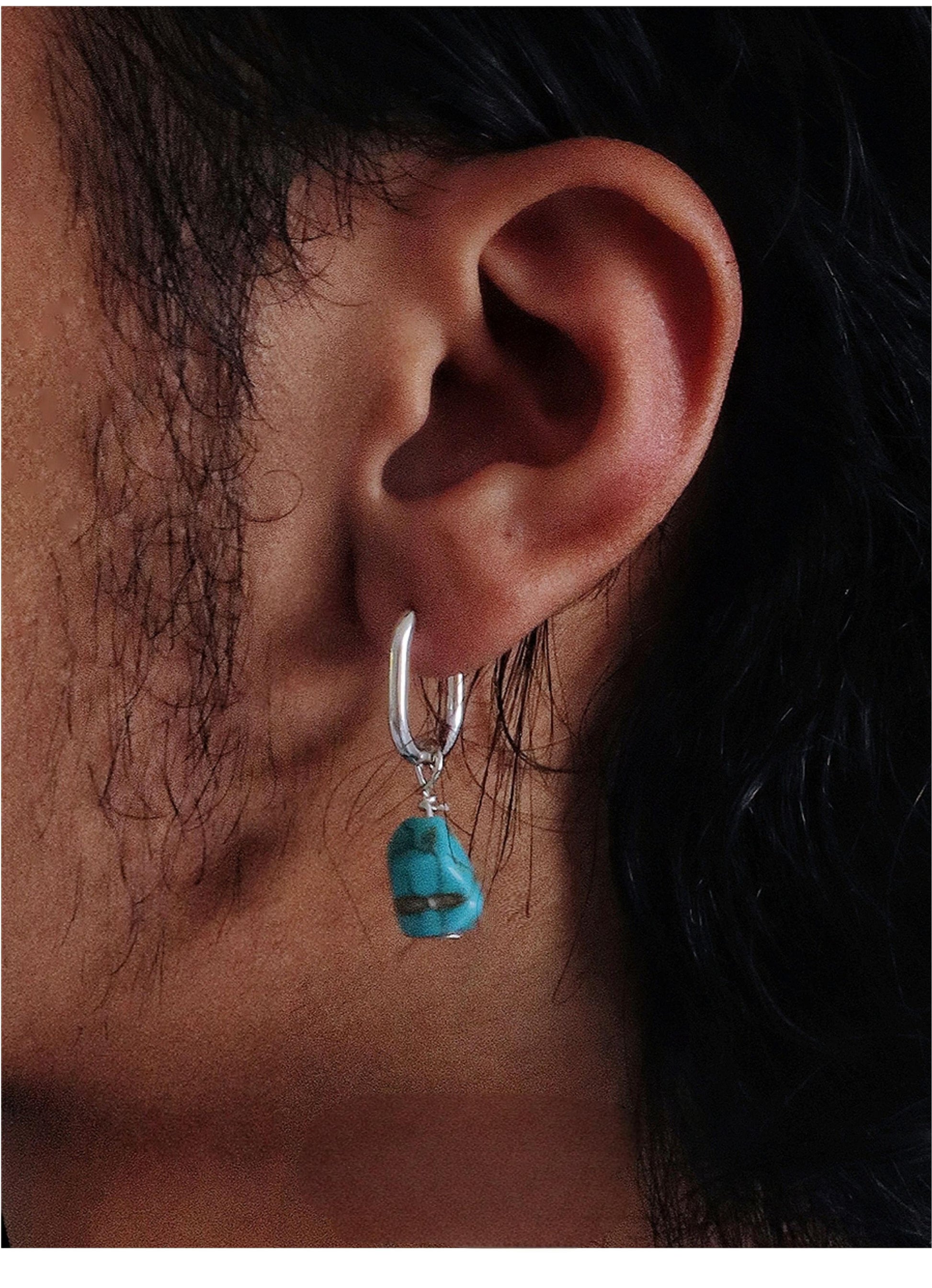“Unisex turquoise earrings worn as ethnic boho fashion accessory”