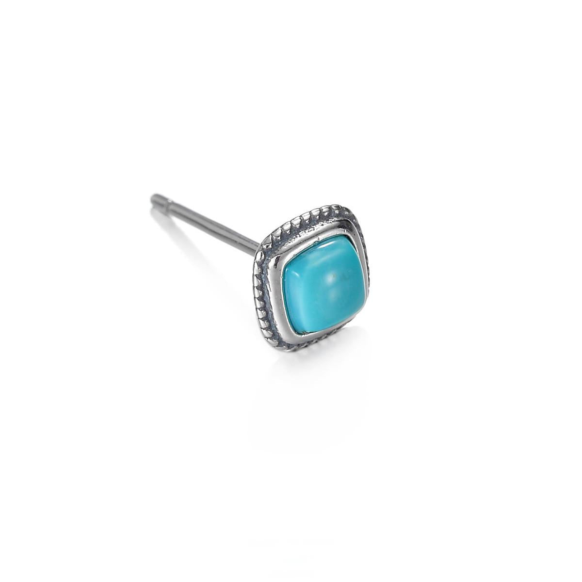 “Close-up of natural turquoise gemstone set in sterling silver”