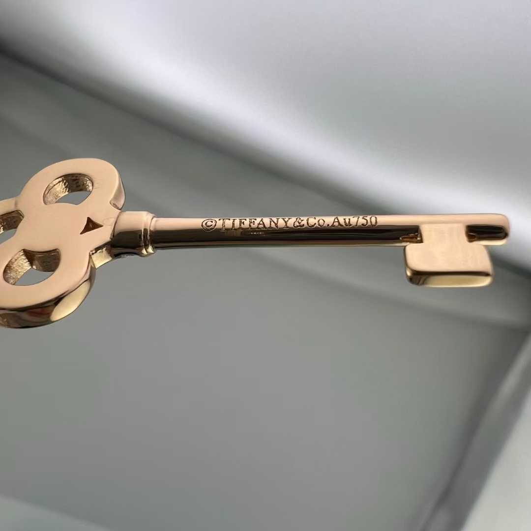 “Close-up of pavé set cubic zirconia on Tiffany crown key pendant”