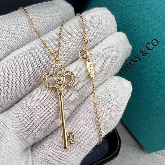 “Tiffany & Co. Keys Collection mini crown key pendant necklace flat lay”