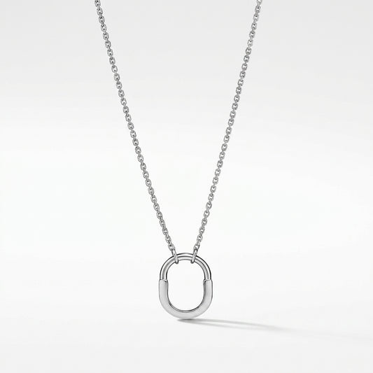 A silver chain necklace with a polished open oval pendant, shown against a clean white background.