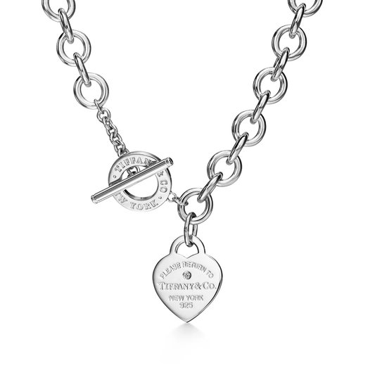 Silver Tiffany Return to Tiffany Heart Tag necklace with diamond accent, featuring Zerra Jewelry branding, close-up view of pendant.
