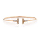 Rose gold bracelet with diamond accents on a white background