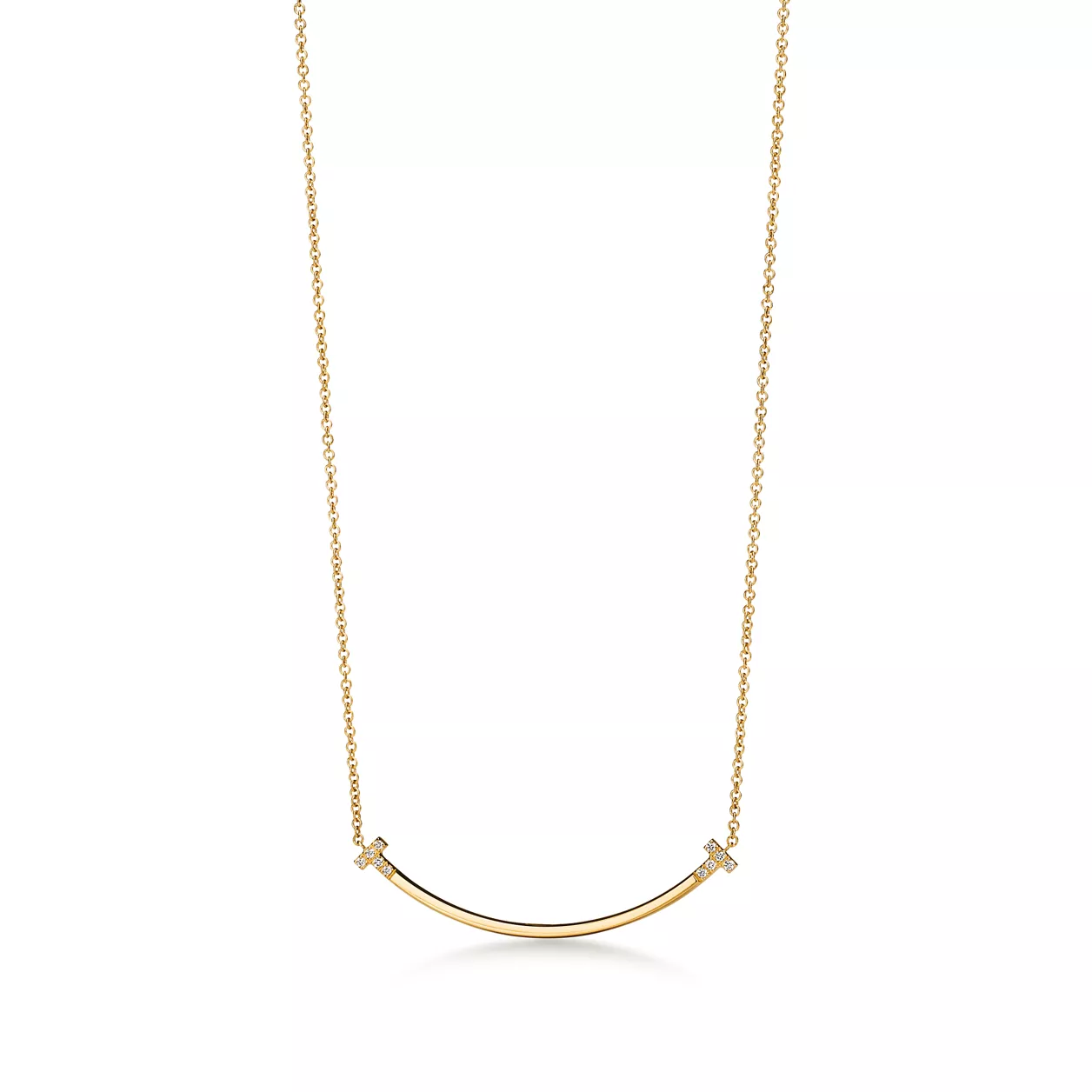Gold necklace with a curved pendant on a white background