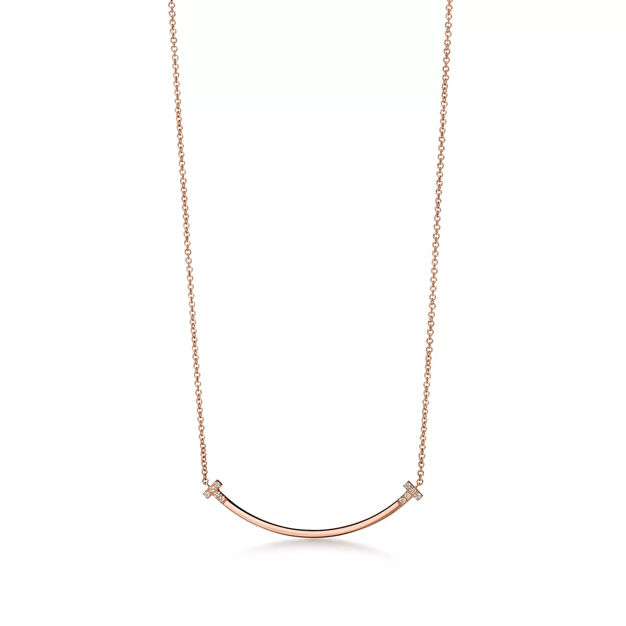 Rose gold curved necklace on a white background