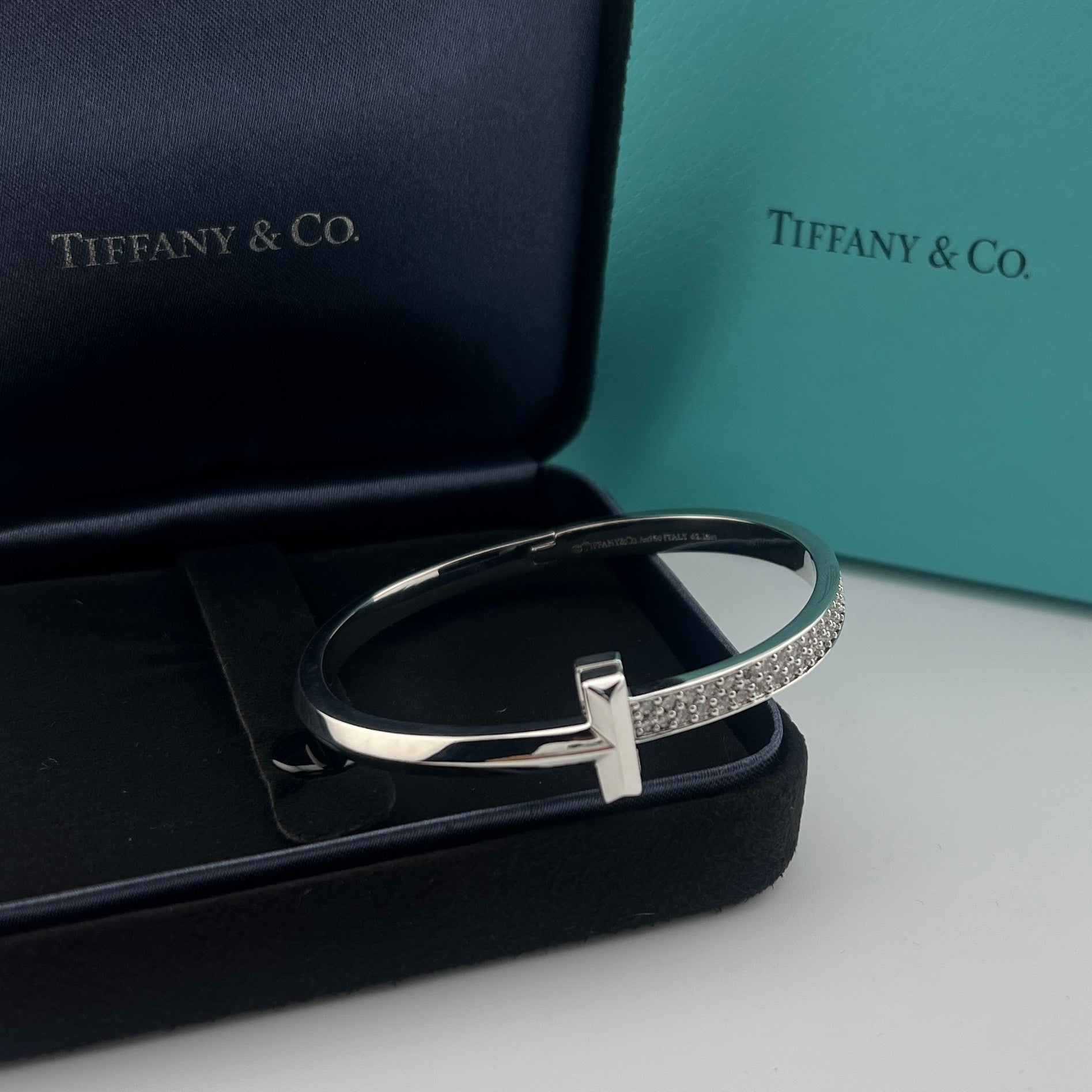 Silver bracelet with diamond accents on a black Tiffany & Co. box