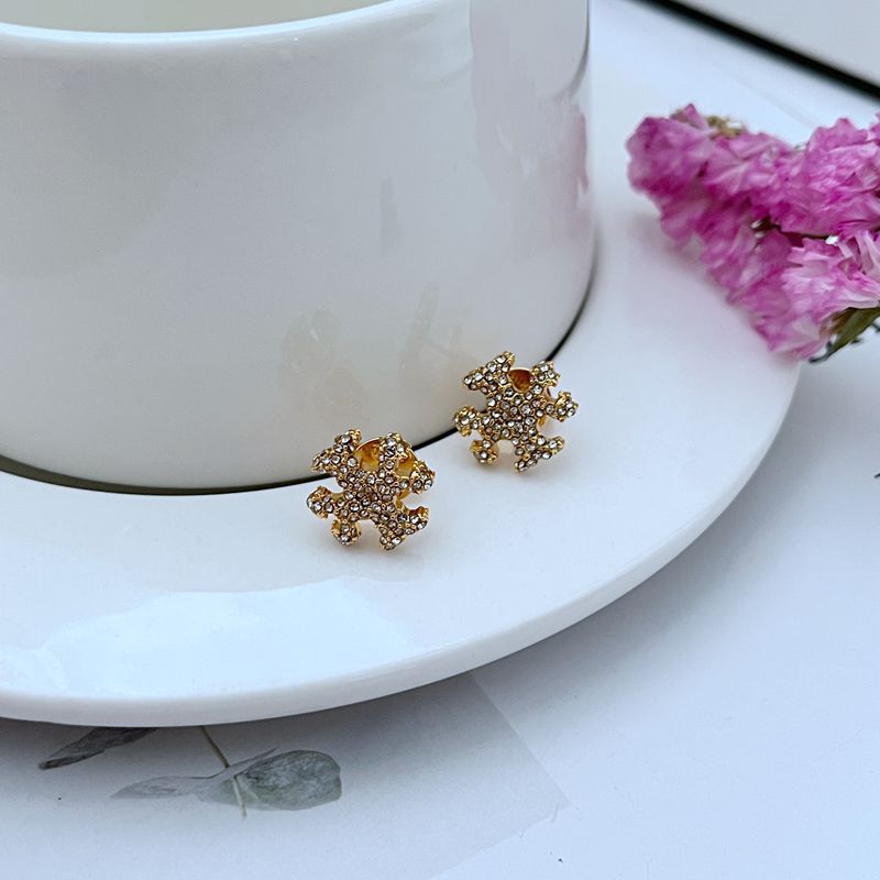  A fashion-forward individual styled in contemporary 2025 trends, showcasing the studs as a key accessory that ties a modern, polished look together.