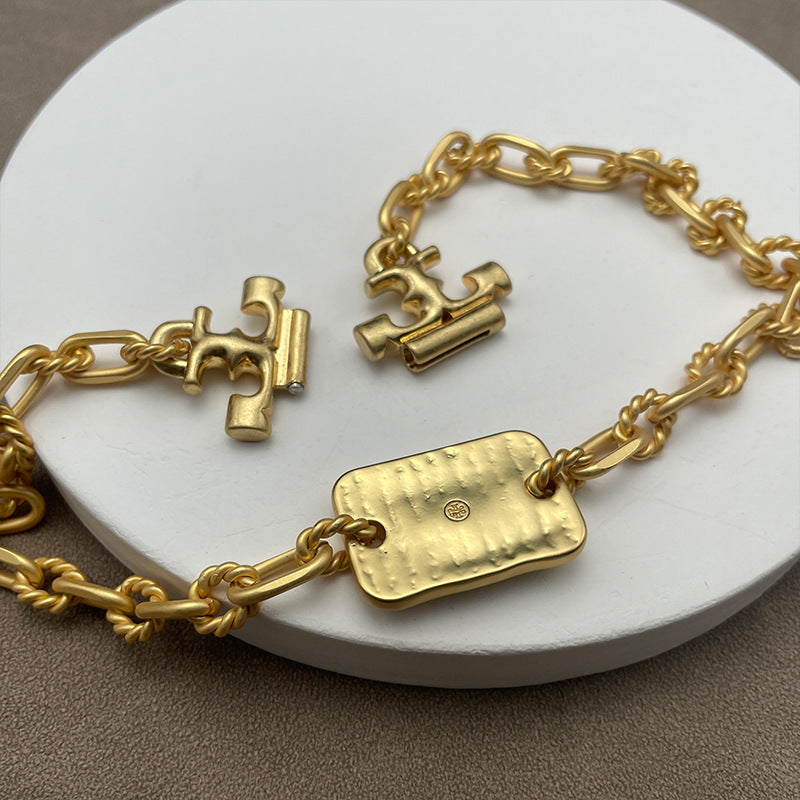 Close-up focusing on the material contrast—like glossy resin against gold metal, or intricate crystal/ enamel detailing.