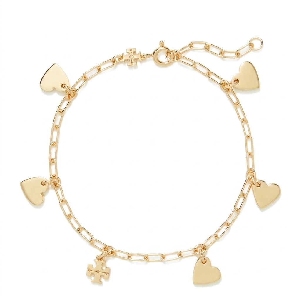 A gold chain bracelet with five dangling heart charms and a small cross charm, displayed on a clean white background.