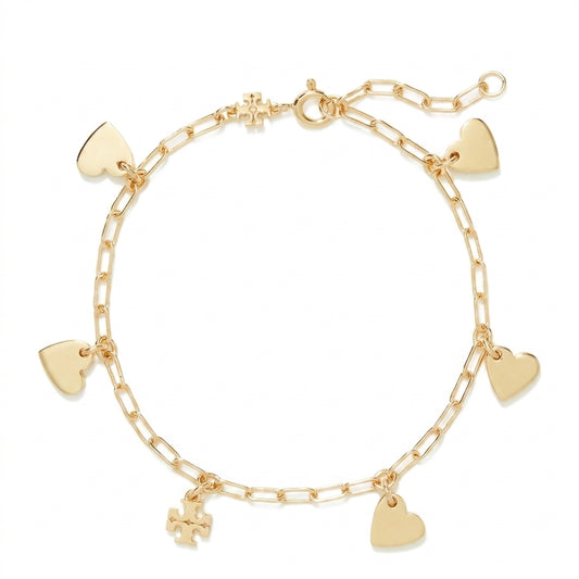 A gold chain bracelet with five dangling heart charms and a small cross charm, displayed on a clean white background.