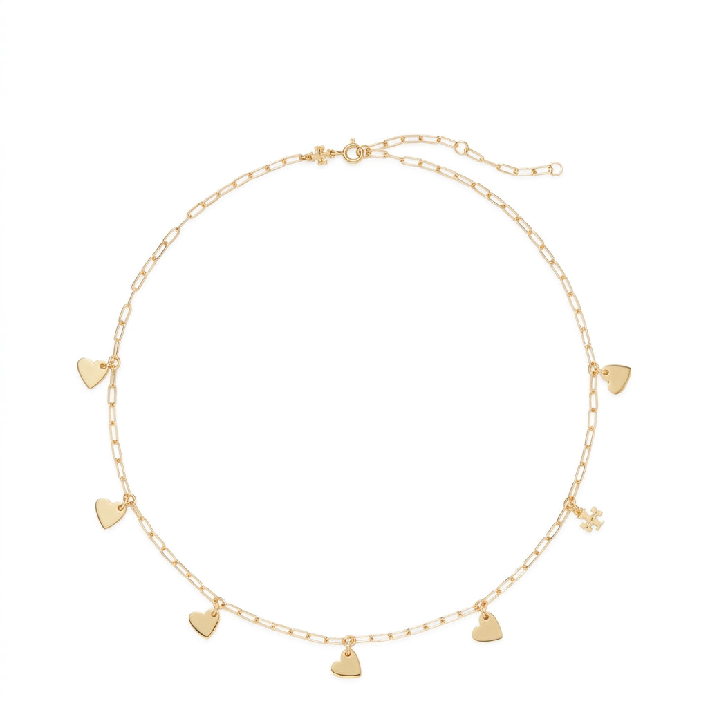 A delicate gold chain necklace with multiple small heart charms and a tiny flower charm, displayed on a clean white background.