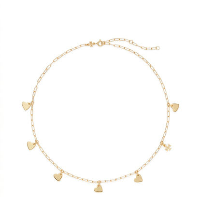 A delicate gold chain necklace with multiple small heart charms and a tiny flower charm, displayed on a clean white background.