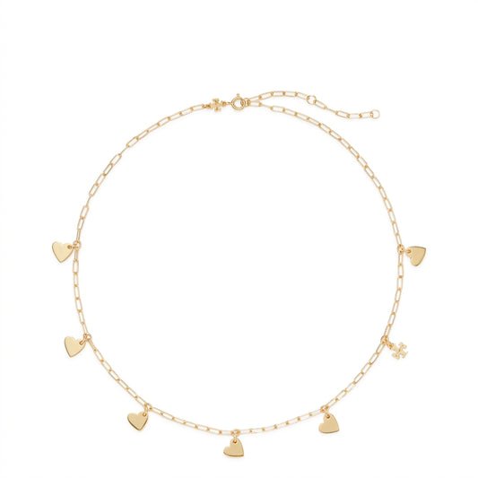 A delicate gold chain necklace with multiple small heart charms and a tiny flower charm, displayed on a clean white background.