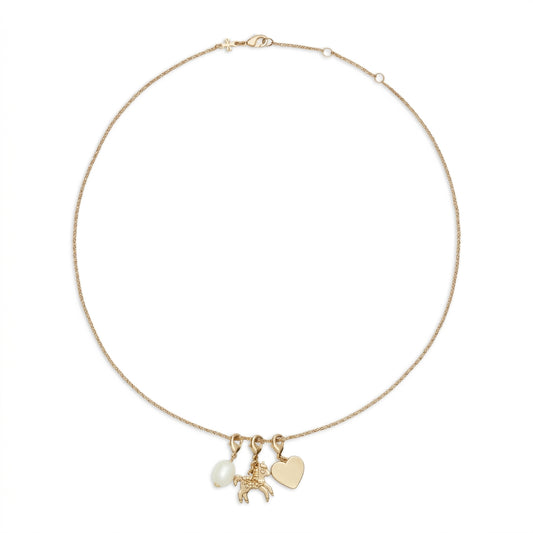 A delicate gold chain necklace featuring three charms: a small white pearl, a gold horse charm, and a flat gold heart pendant, displayed on a clean white background.