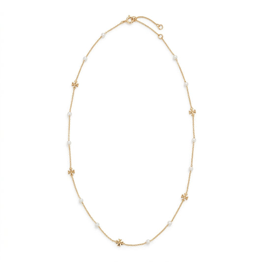 A delicate gold chain necklace featuring small white pearl beads and four gold flower-shaped charms spaced along the chain, displayed on a clean white background.