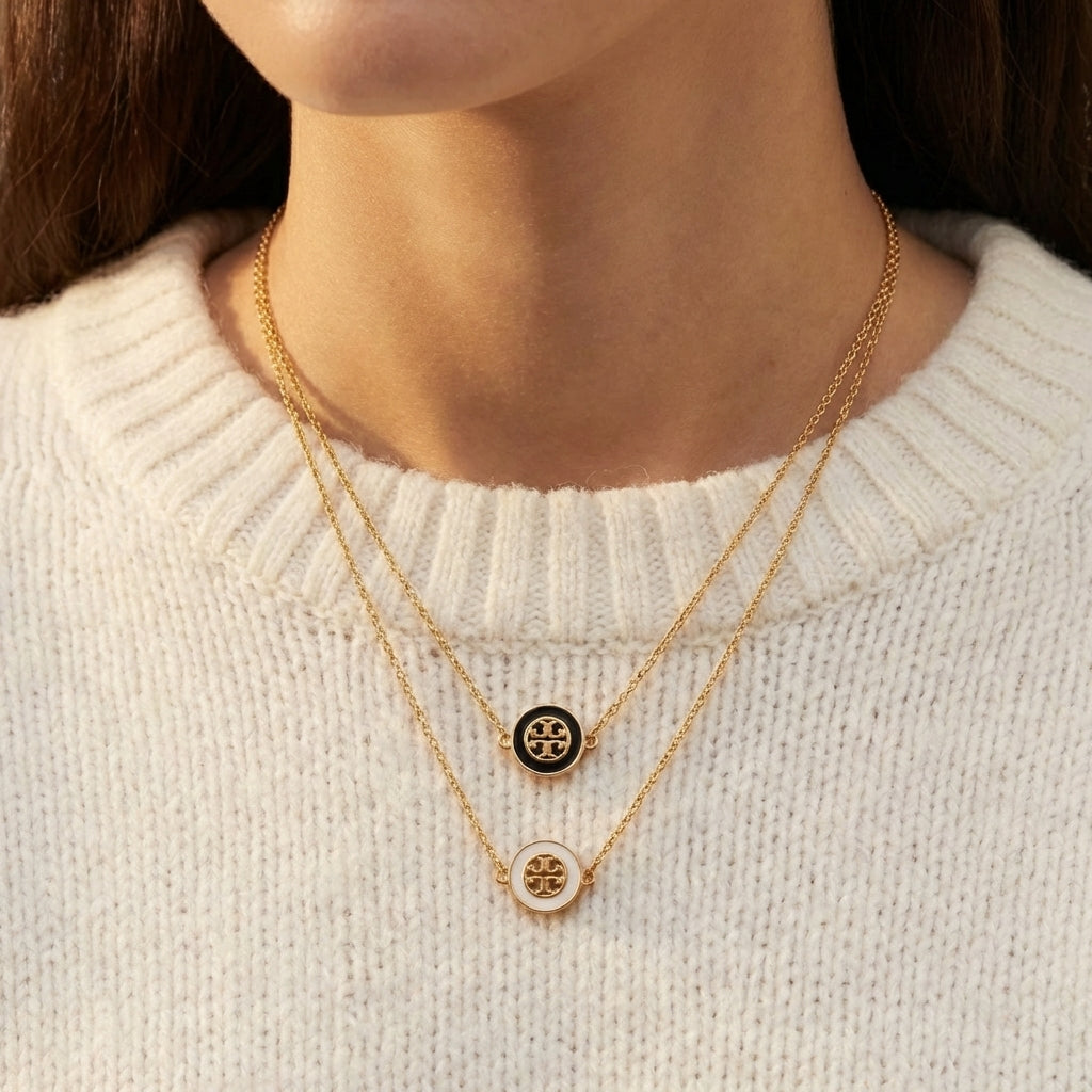 Close-up from lips to chest, cropped above the mouth. Model in a white top, wearing a single necklace. Pendant centered on the collarbone. Soft skin texture, natural lighting, minimal high-end background (light gray or off-white).