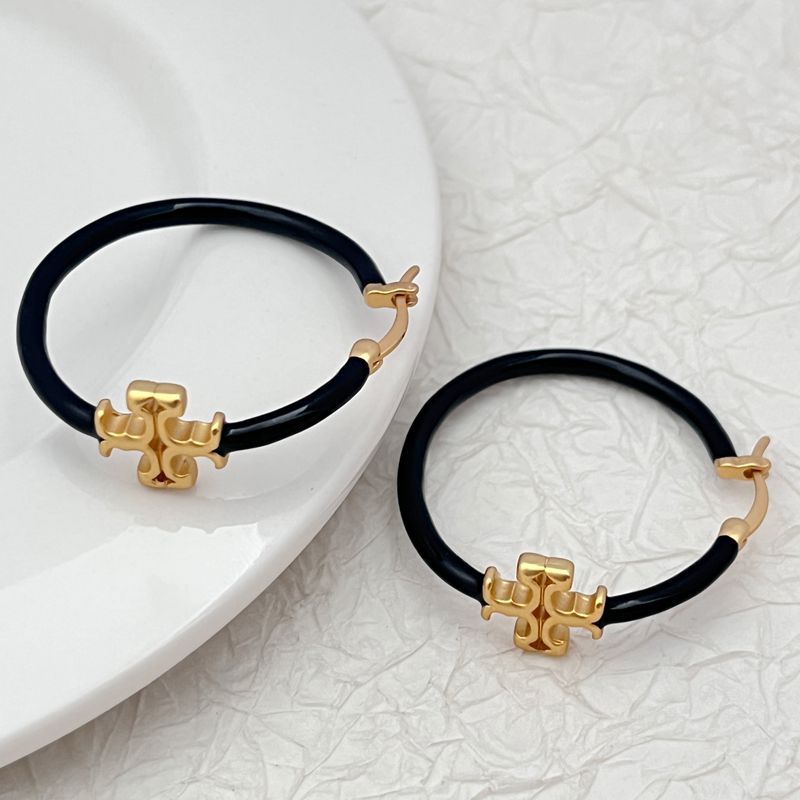 Clean, front-facing shot of a single hoop against a neutral background, clearly displaying the Double T logo as a distinct element within the hoop's circle.