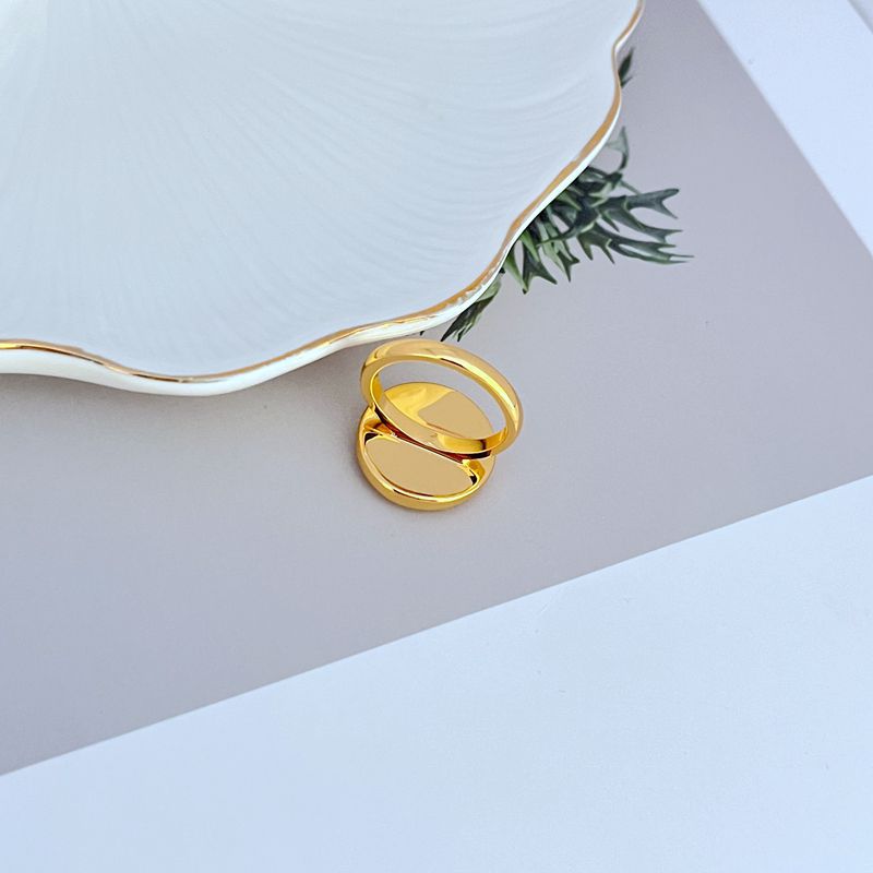 Clean shot of the ring on a light, airy background (like sand-colored or light blue), highlighting the shell detail and enamel color.