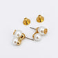 Pair of pearl earrings with gold posts on a white background