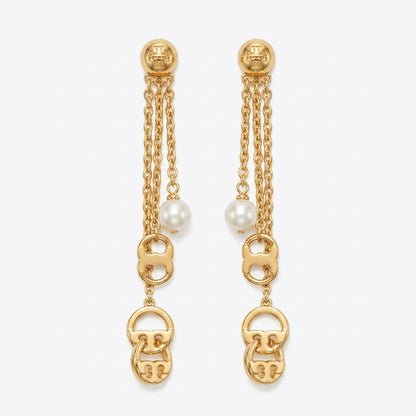 A pair of gold dangle earrings with triple chain drops, white pearl beads, and interlocking gold logo charms at the bottom, shown on a light gray background.