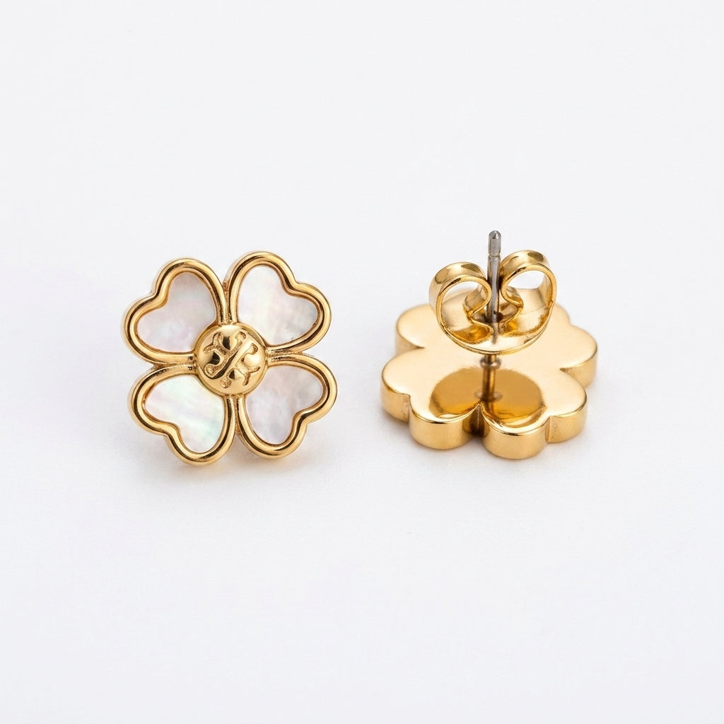 Gold flower-shaped earrings on a white background