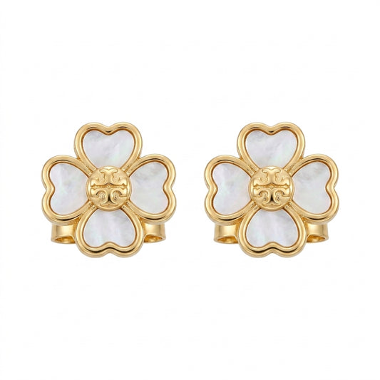 Gold and white floral earrings on a white background
