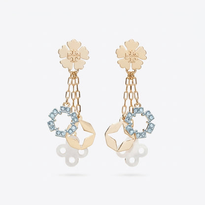 A pair of gold-tone dangle earrings featuring a flower-shaped stud, hanging chain links, a geometric gold charm, and a circular ring set with light blue rhinestones, shown against a light gray background.