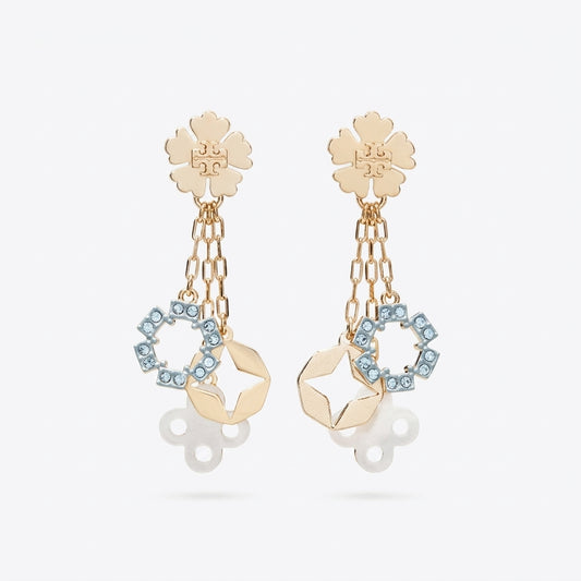 A pair of gold-tone dangle earrings featuring a flower-shaped stud, hanging chain links, a geometric gold charm, and a circular ring set with light blue rhinestones, shown against a light gray background.