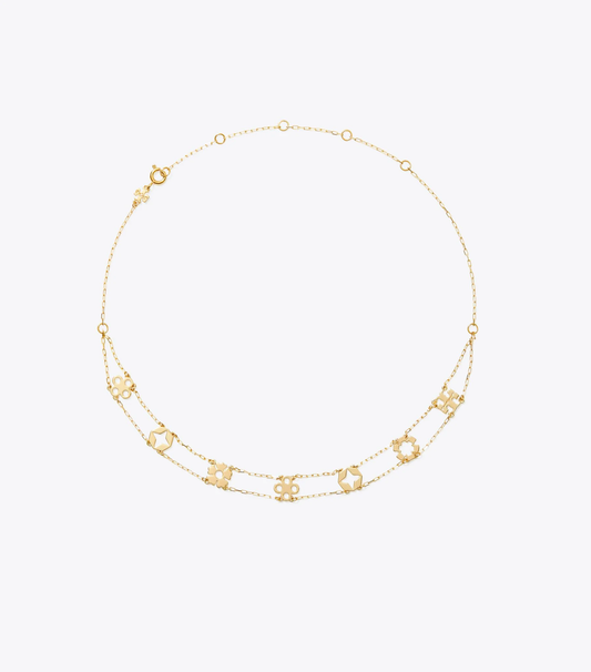 A delicate gold chain necklace featuring multiple small interlocking double-C logo charms, displayed on a clean white background.