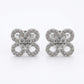 Butterfly-shaped earrings with gemstones on a white background
