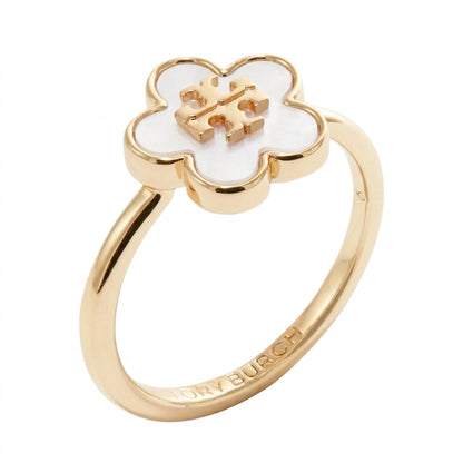 A gold-plated Roy Burch ring featuring a five-petal flower motif with a white inlay and a raised gold 'RB' monogram at the center. The inner band is engraved with 'ROY BURCH'.