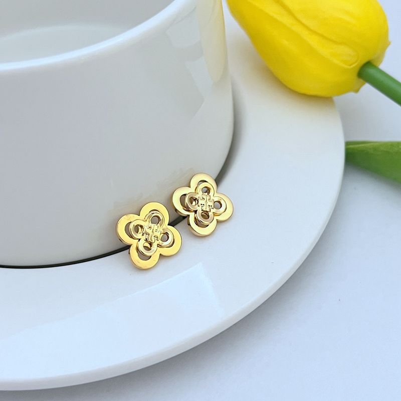  Extreme close-up focusing on the texture and three-dimensional sculpting of individual flowers and leaves within the cluster, highlighting the craftsmanship.