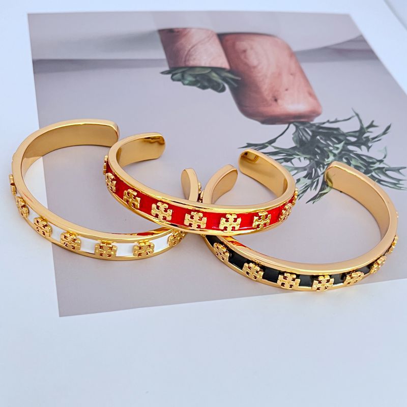 Bangle displayed standing upright against a plain white or light gray background, emphasizing the bold color segments.