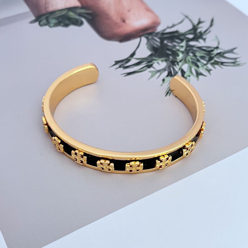 Bangle displayed standing upright against a plain white or light gray background, emphasizing the bold color segments.